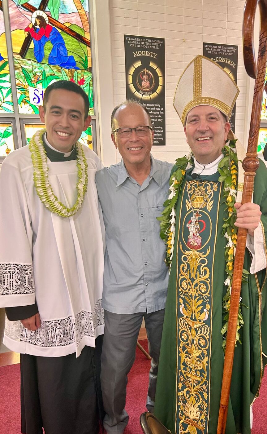 A fellowship member with a priest and the bishop after Mass